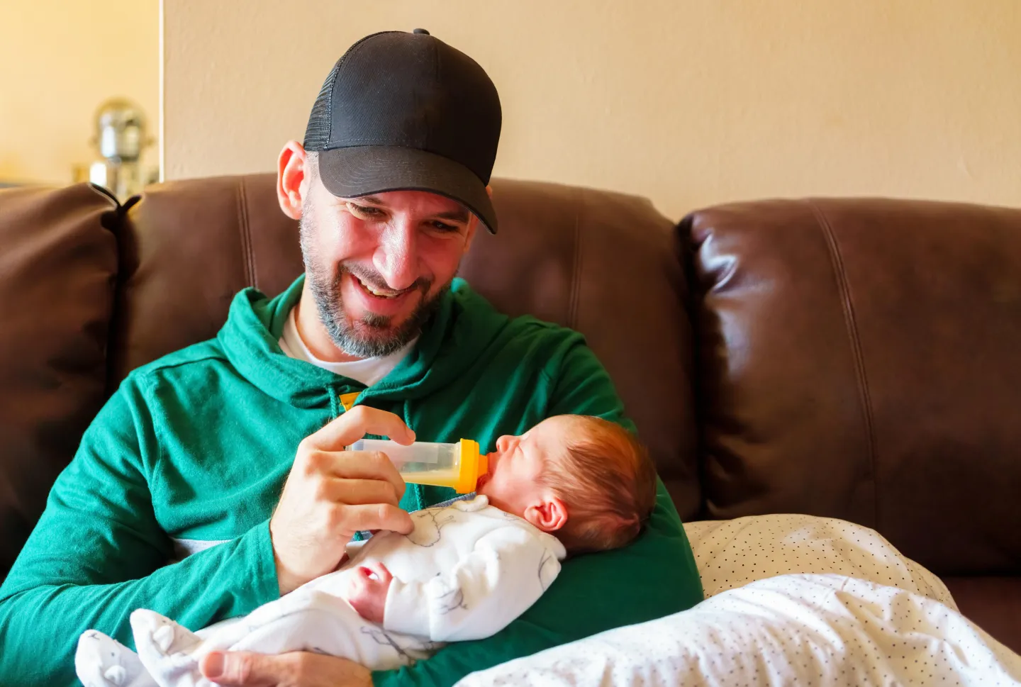 A happy father feeding his baby. Roberto Machado Noa/LightRocket via Getty Images