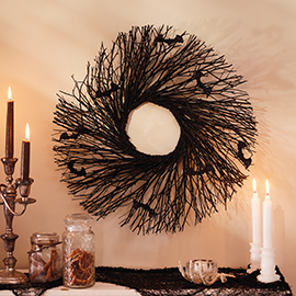 Bats in black wood wreath.