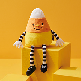 Smiling candy corn plush.