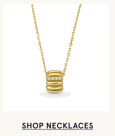 Gold chain necklace with ribbed diamond barrel pendant. Click here to shop necklaces