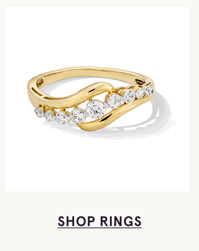 Gold bypass ring with graduated row of round diamonds. Click here to shop rings