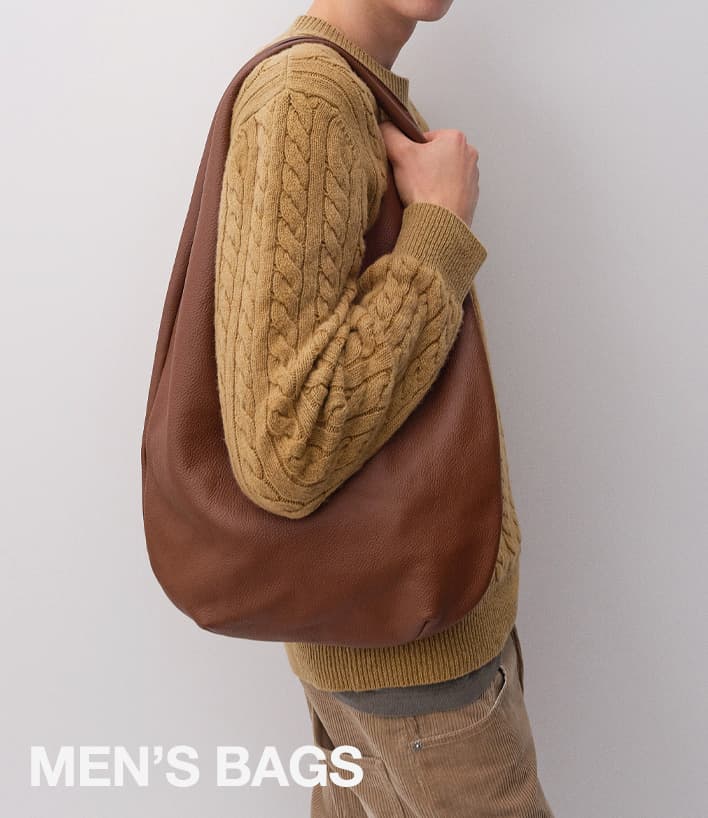 A.P.C. man holding Fall bag