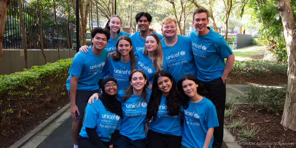 A group of young people in blue UNICEF shirts