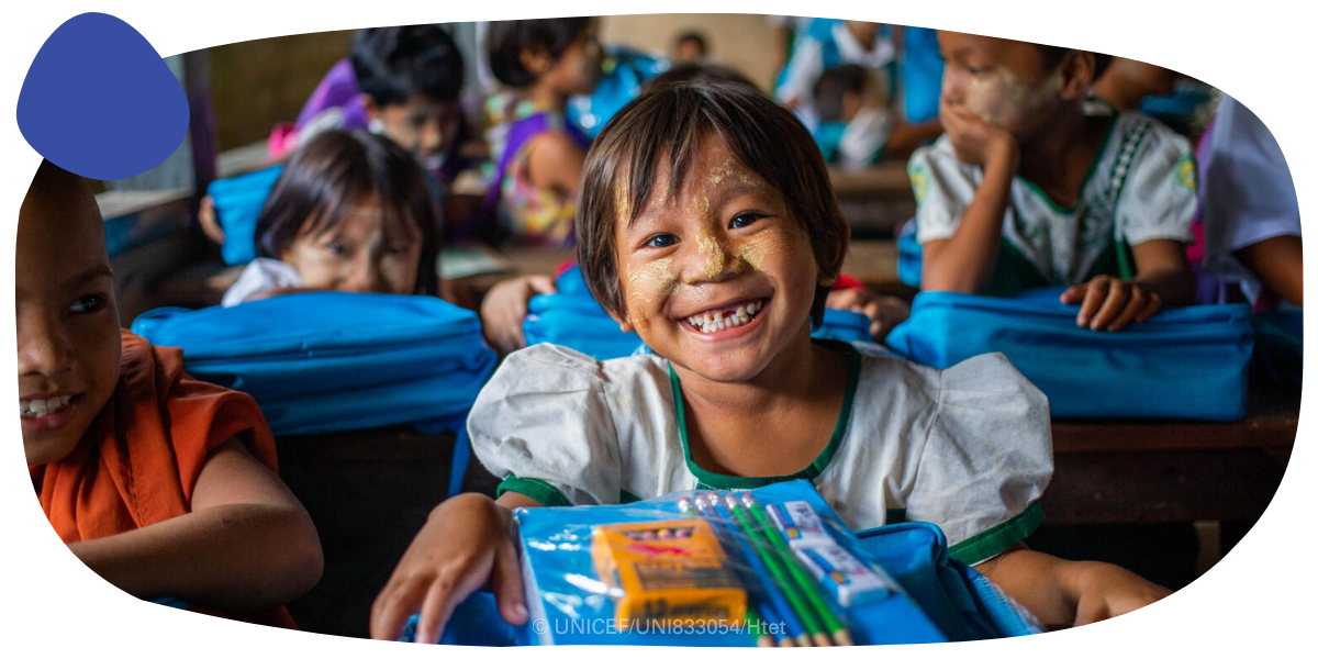 A smiling child in a classroom
