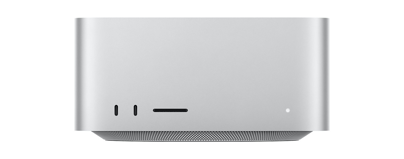 Mac Studio, front, two USB-C ports, SDXC card slot, status indicator light, tapered base at bottom, flat top, rounded sides, straight edges, silver color