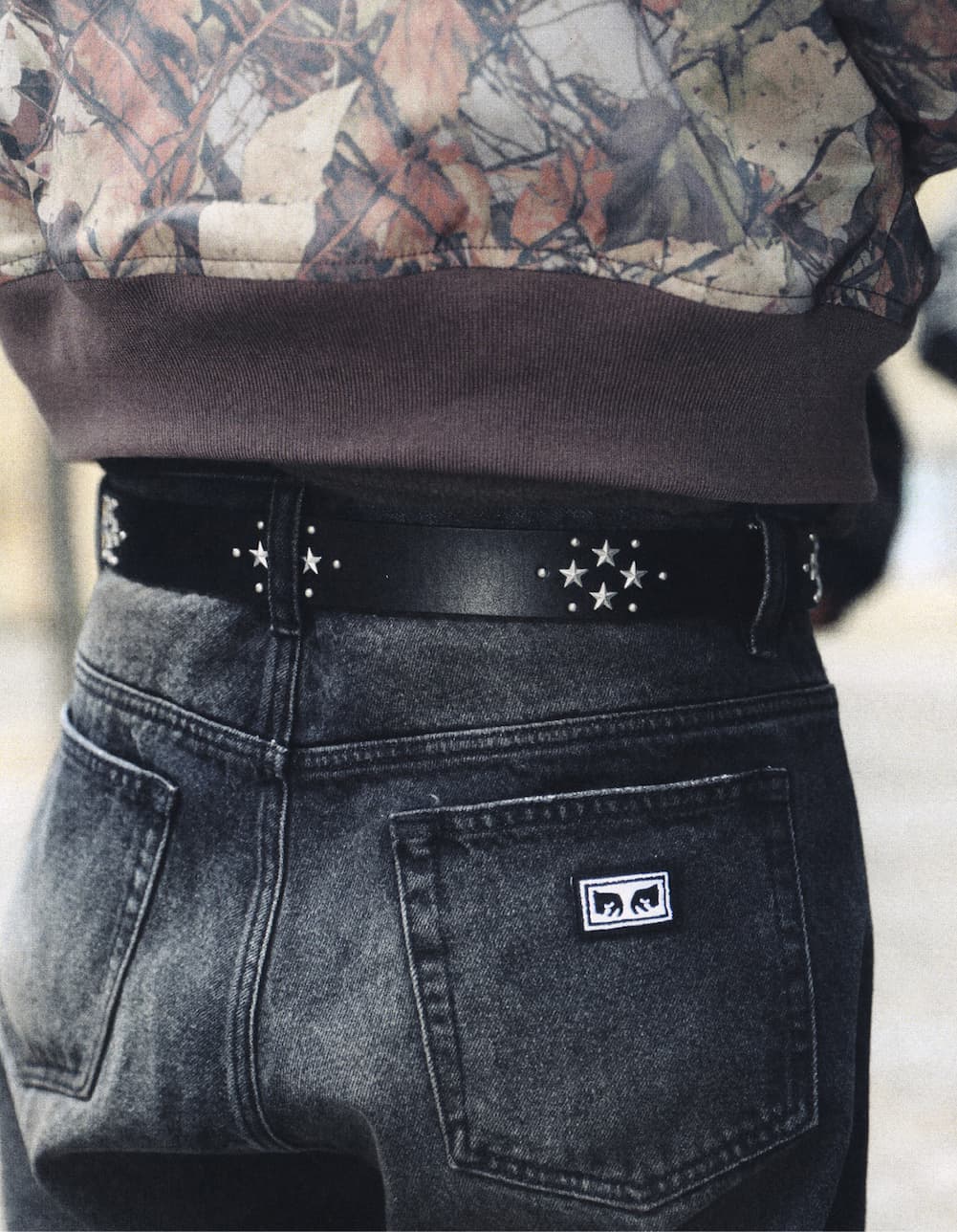 Up close image of a male model  wearing OBEY belt from fall collection 2026
