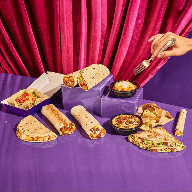 Various Taco Bell menu items on a table.