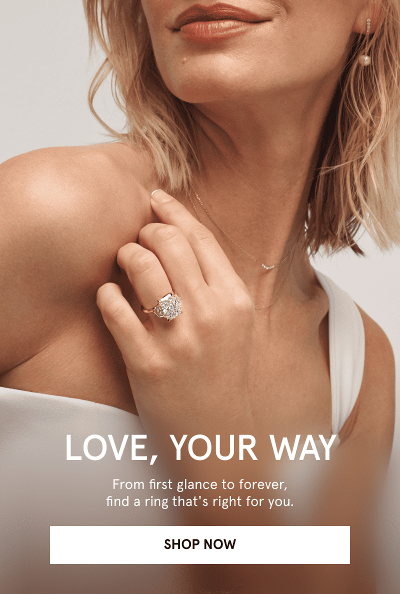 Woman wearing a diamond ring, pearl earrings and a dainty necklace. Find a ring that’s right for you. Click shop now.