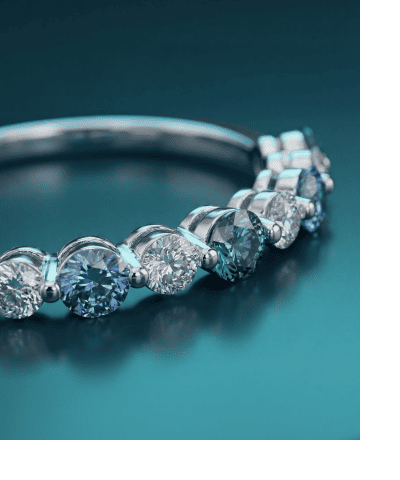 White gold ring with alternating round blue sapphires and diamonds.