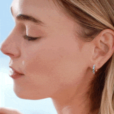 Animation of a woman wearing various blue sapphire Le Vian jewelry outdoors.