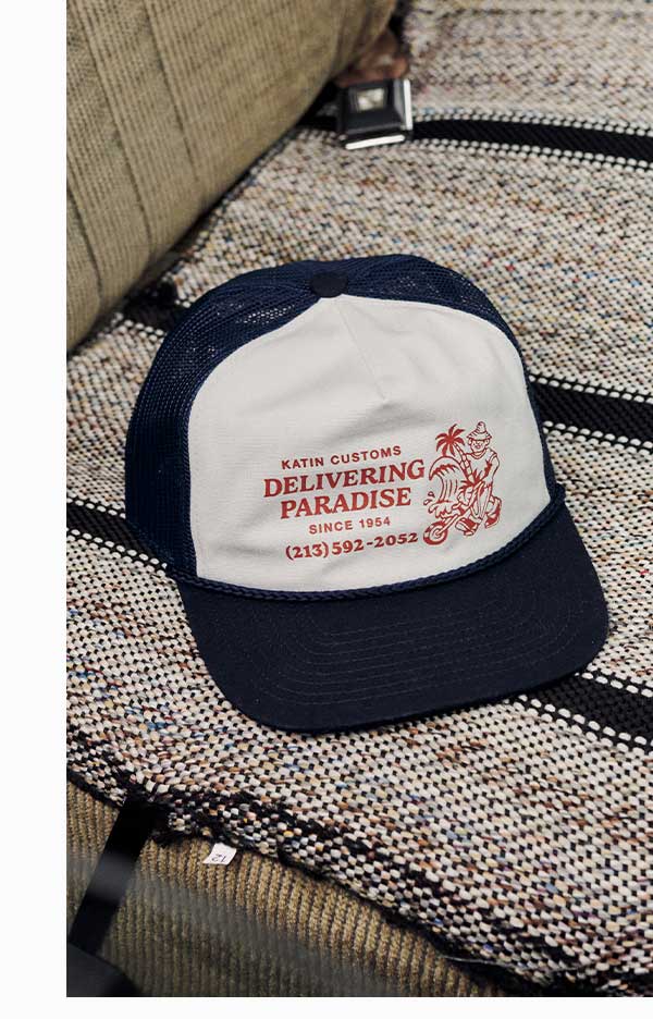 Katin Wheeler Trucker Hat sitting on interior of truck.