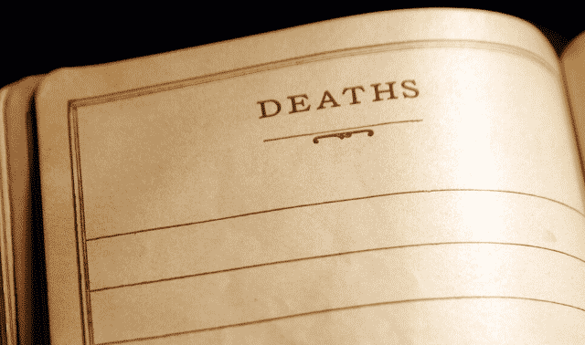 An open book with "DEATHS" written at the top of a blank page, indicating a record for noting deaths.