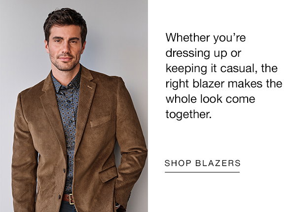Model wearing a brown blazer over a blue patterned shirt. Text reads: 