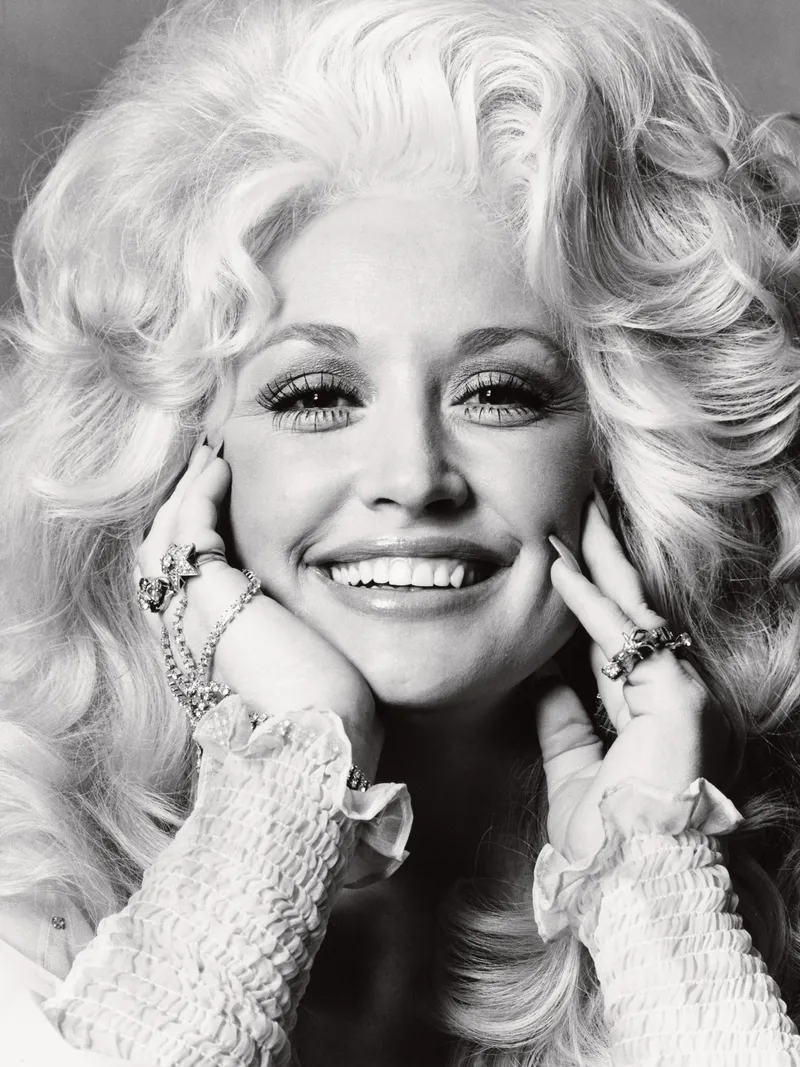 Image may contain: Dolly Parton, Face, Happy, Head, Person, Smile, Photography, Portrait, Adult, Wedding, Blonde, and Hair