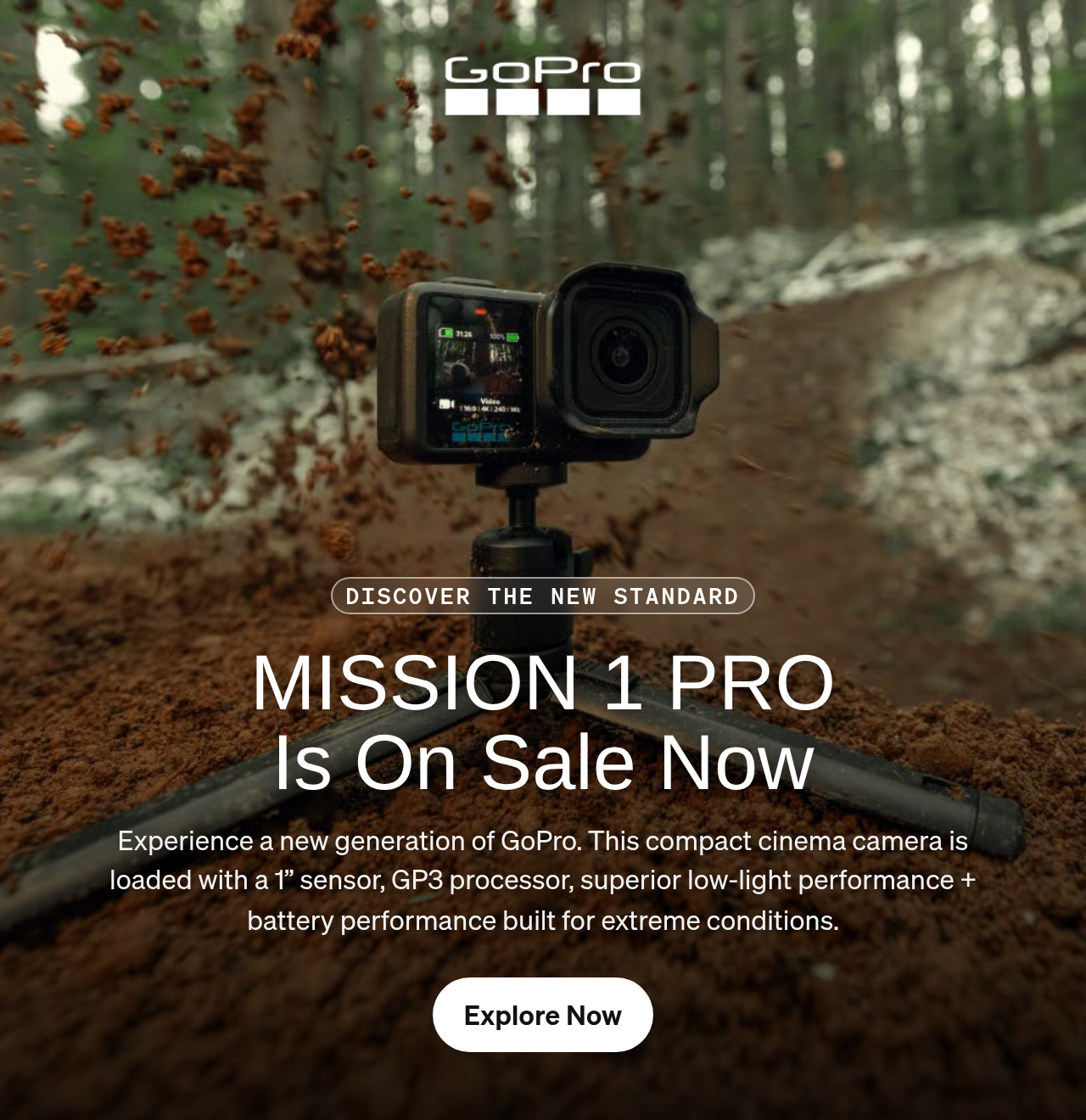 GoPro camera on a tripod capturing dirt spraying on a forest trail.