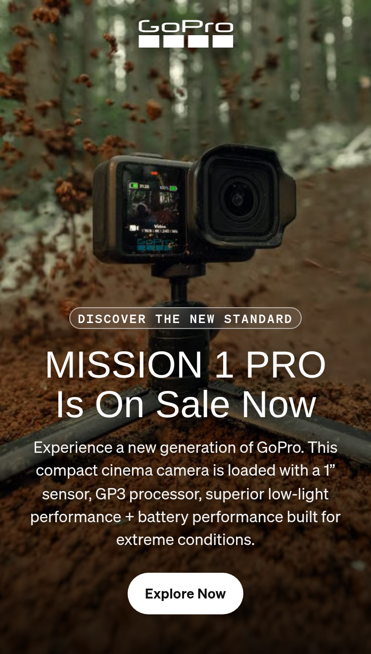 GoPro camera on a tripod capturing dirt spraying on a forest trail.