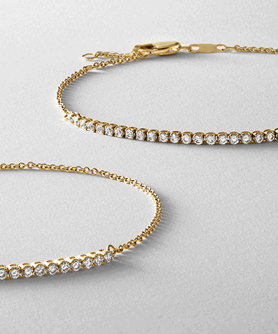 Yellow gold diamond tennis bracelets.