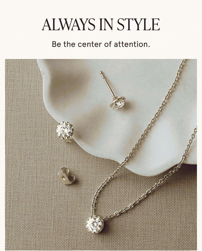 Solitaire diamond pendant and matching stud earrings. Be the center of attention. 