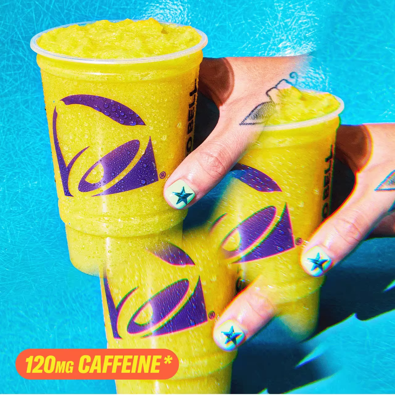 120mg Caffeine*. A hand holding a Taco Bell Pineapple Citrus Energy Freeze.