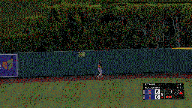An animated gif of Angel Martínez running over to make a leaping catch in front of the wall