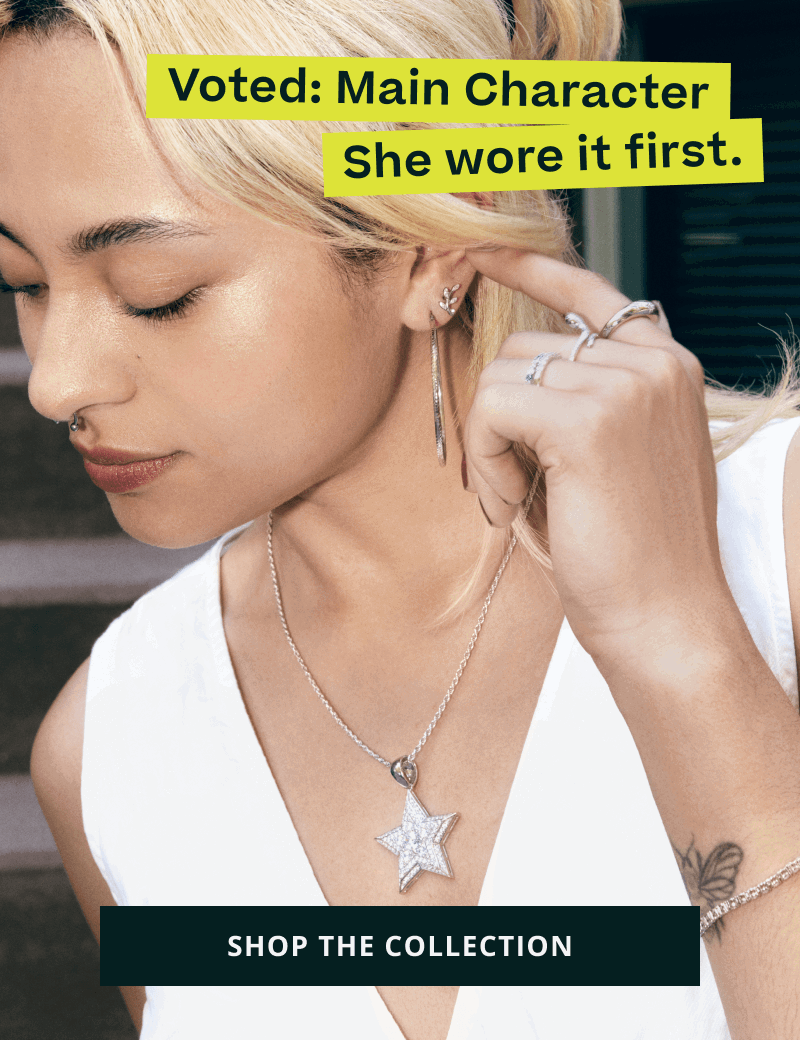 Model with silver-set jewelry with large star-pendant. Voted: Main Character. Click here to shop the collection