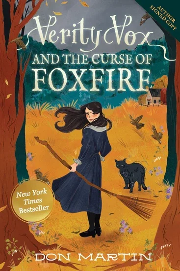 Don Martin signs the paperback of VERITY VOX AND THE CURSE OF FOXFIRE