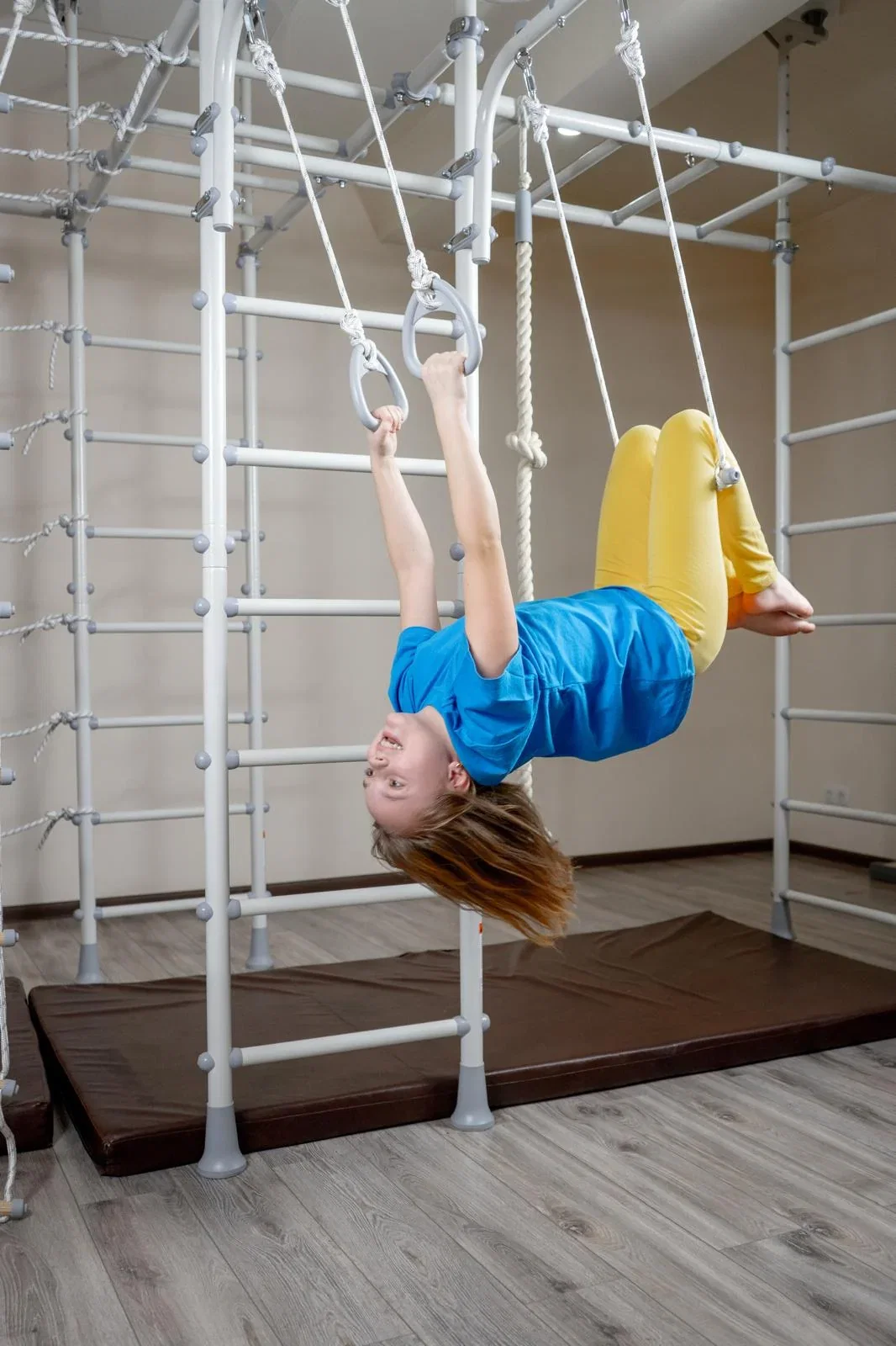 Kids playing on Brainrich tension-mounted play gyms