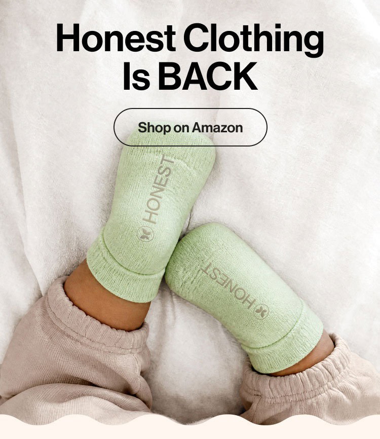 Baby wearing green Honest Company socks 