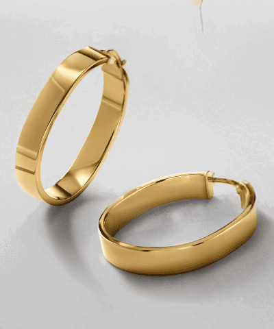 Yellow gold oval hoop earrings.