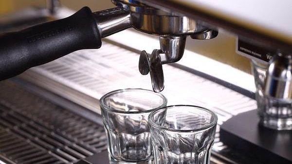 Espresso machine group head with portafilter and shot glasses