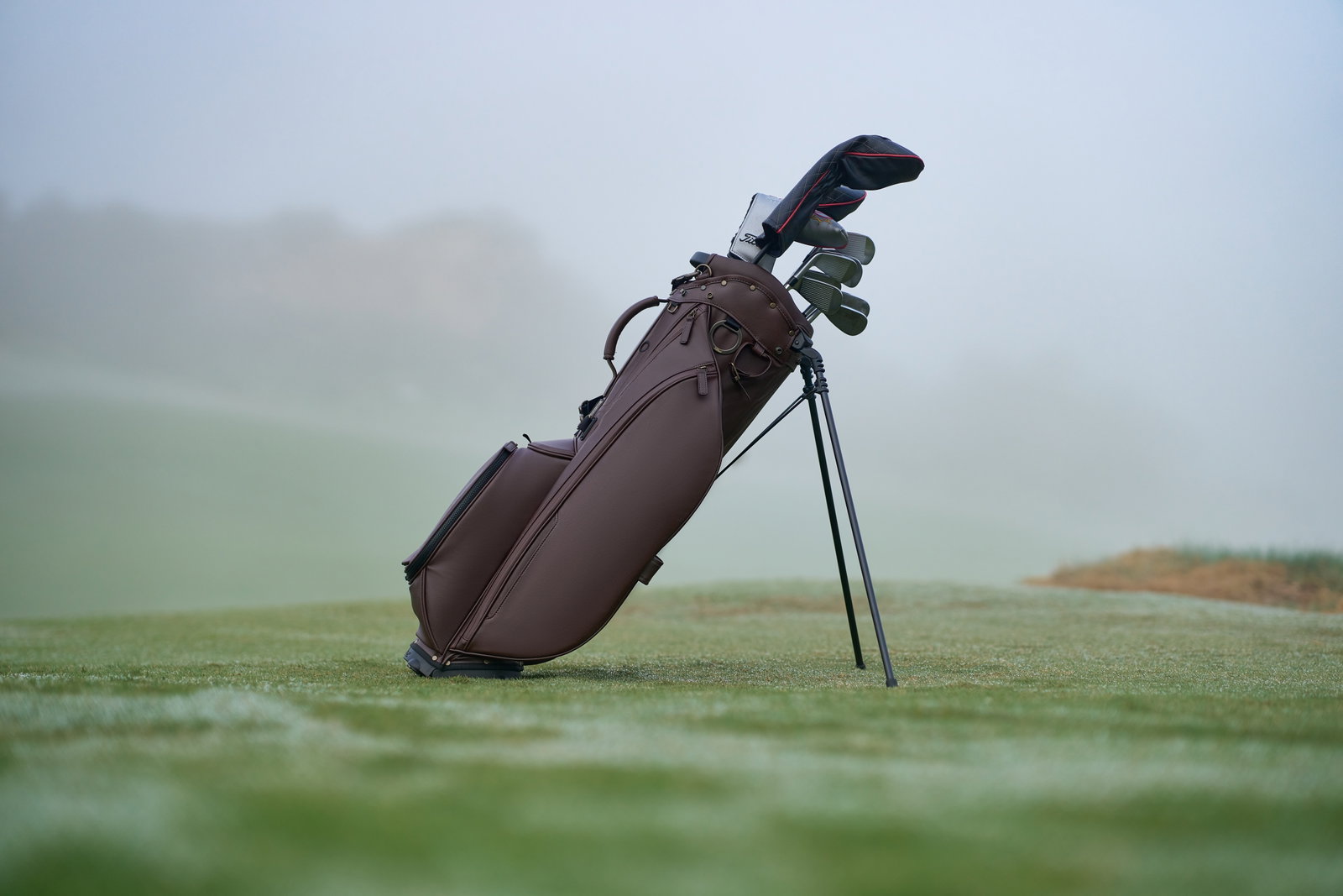 Image of a Titleist Members Golf Bag on a misty Golf Course