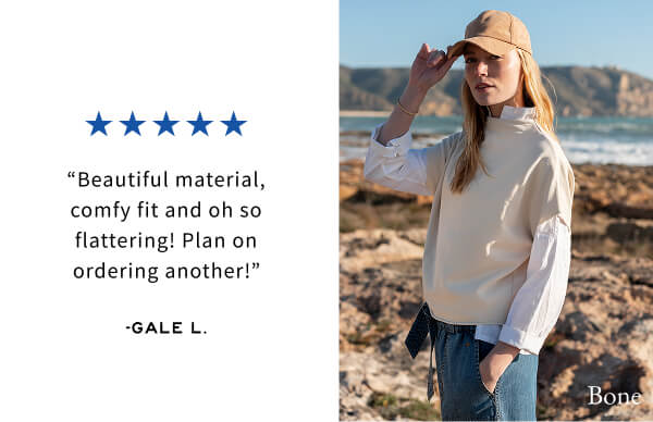 "Beautiful material, comfy fit and oh so flattering! Plan on ordering another!" - Gale L. - Image of a woman wearing a cream French terry dolman top
