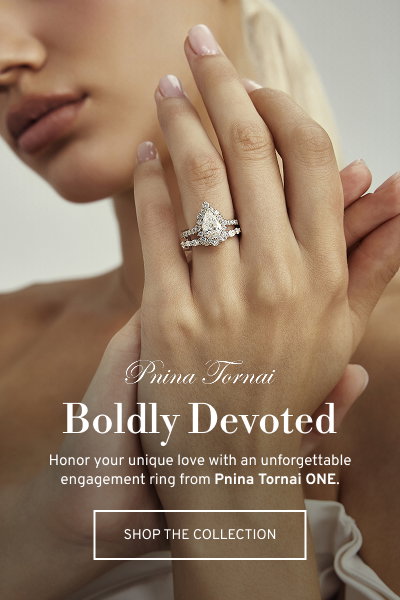 Close-up of engagement ring on hand. Boldly Devoted. Honor your love with Pnina Tornai ONE. Click to Shop The Collection