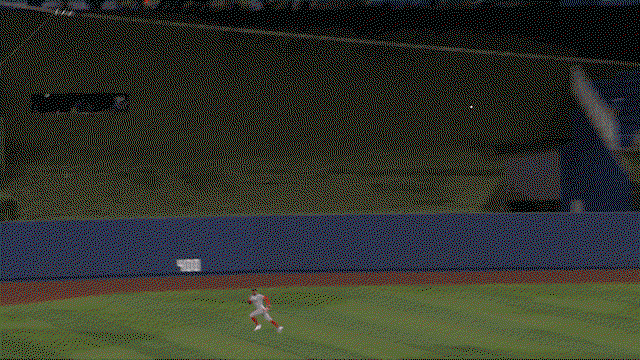 An animated gif of Ceddanne Rafaela racing over and leaving his feet to make a diving catch
