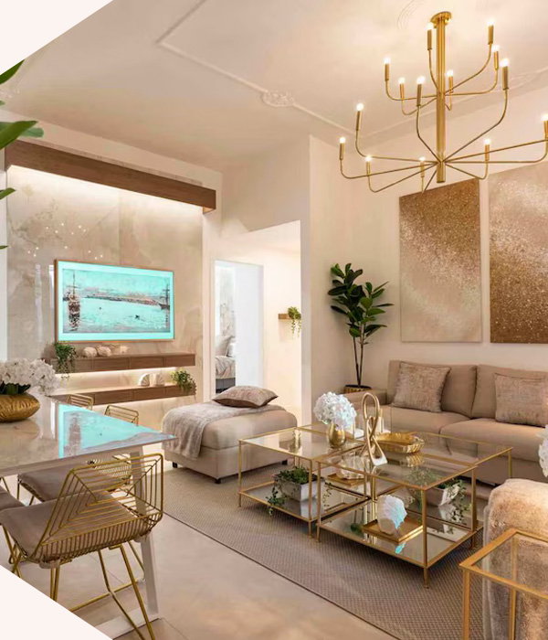 Light-filled Roman residence blending gilded accents, elegant lounge spaces, and contemporary charm.