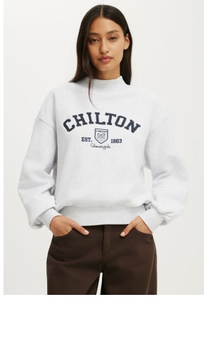 Woman wearing white Chilton sweatshirt and black pants