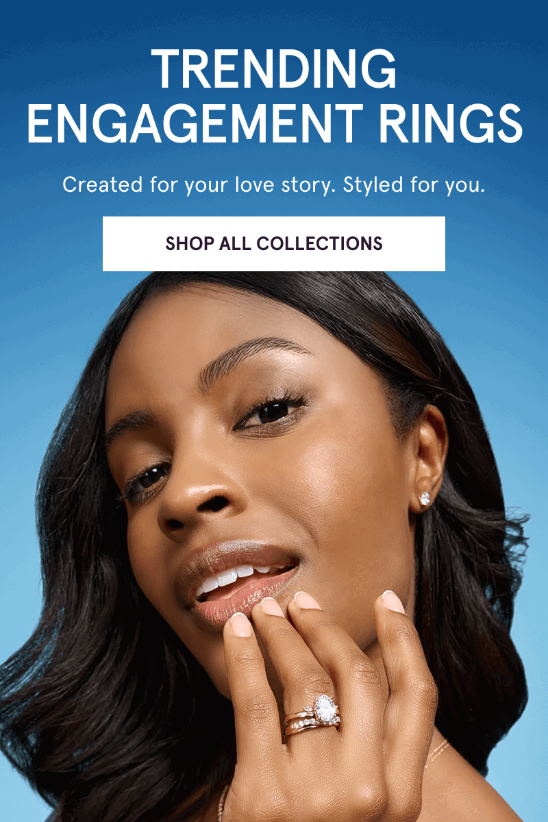 Model wearing diamond bands stack & oval engagement ring. Trending Bridal. Click here to shop all collections