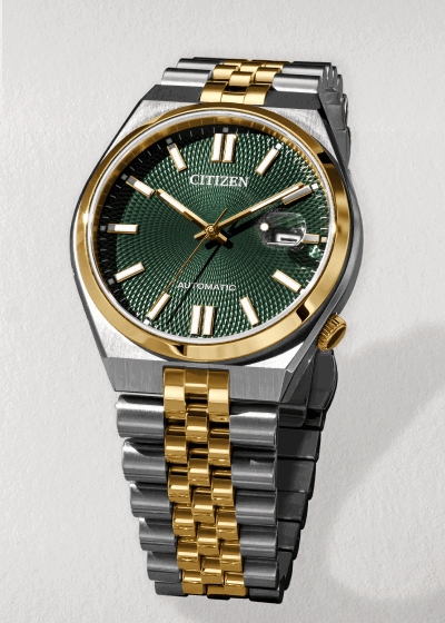 Two-tone Citizen automatic watch with green dial and gold-tone accents.