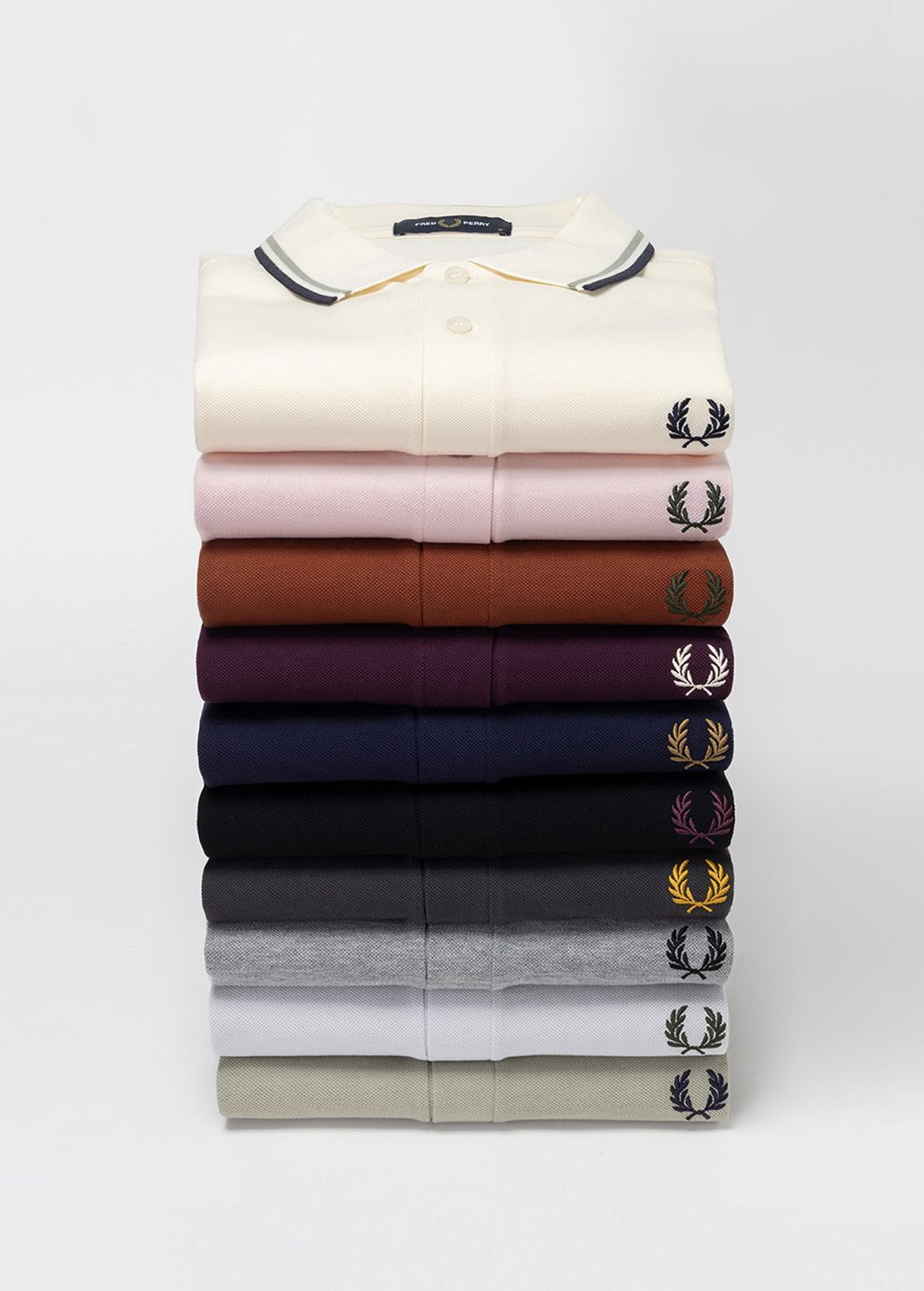 A selection of Fred Perry Shirts stacked 