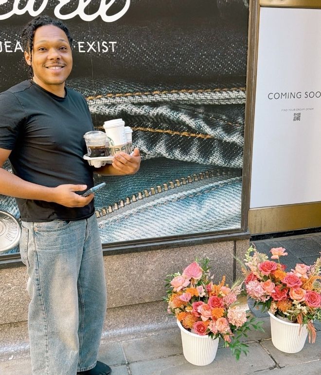 Marcus holding a tray of coffees and looking after the flowers before the TODAY show!
