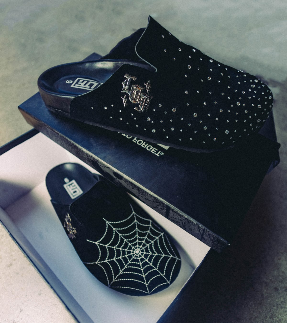 Shop men's shoes, featuring the LTF Mules with sparkles and spiderwebs.