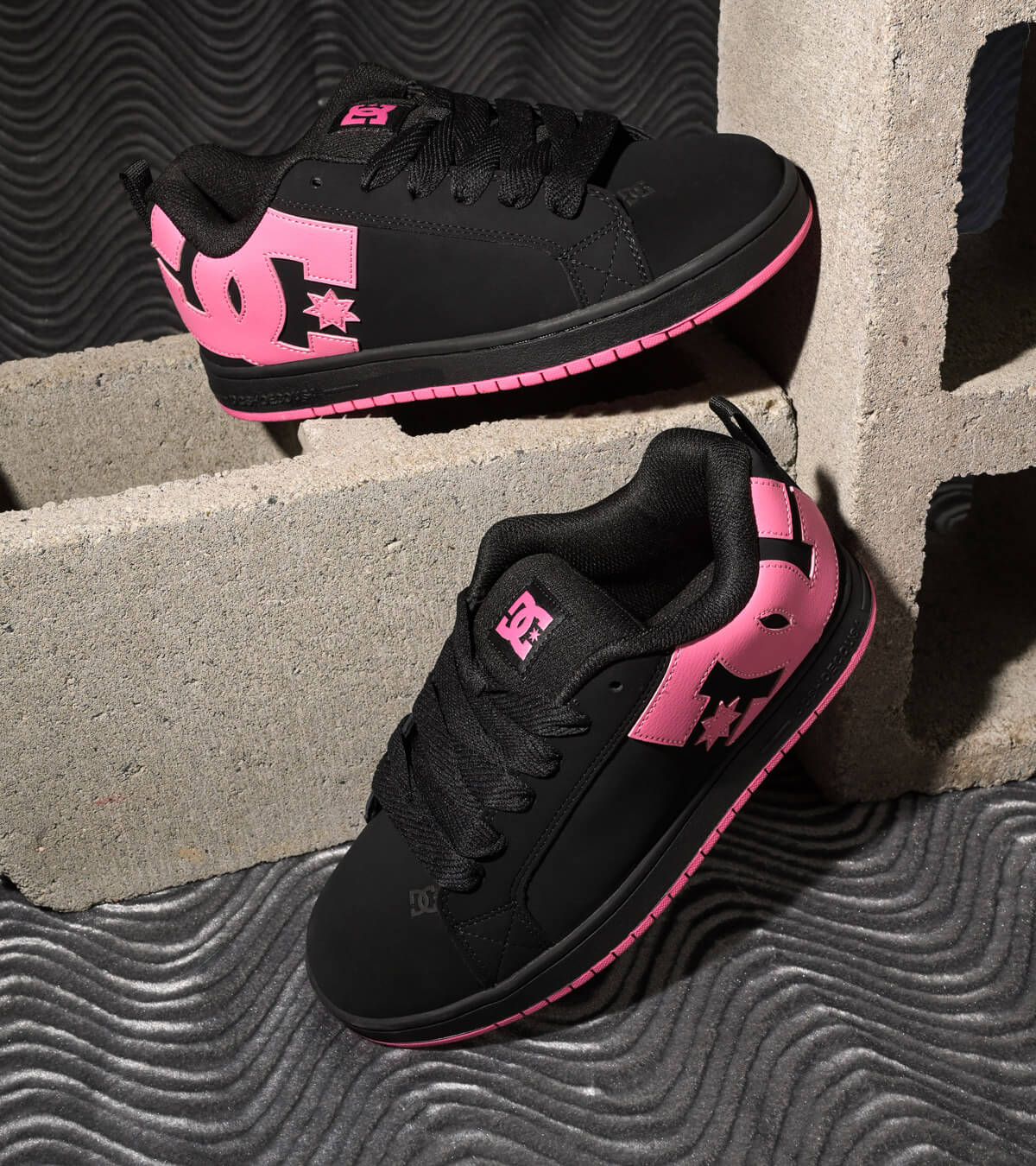 Shop women's shoes, featuring DC Court Graffiks in black wtih pink accents.