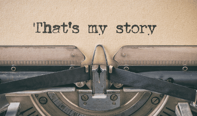 Close-up of an old typewriter with the text "That's my story" typed on a piece of paper.