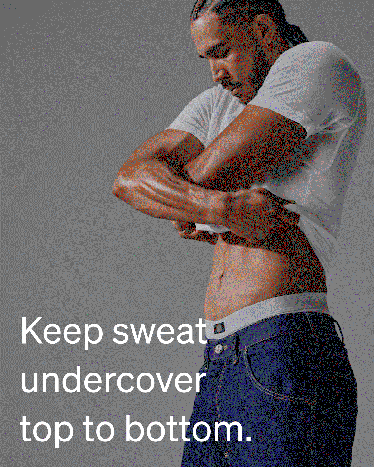 Model wearing a white performance tee DropTemp® Dry and jeans with the headline “Look good. Stay cool.” showcasing the shirt’s clean, everyday fit.