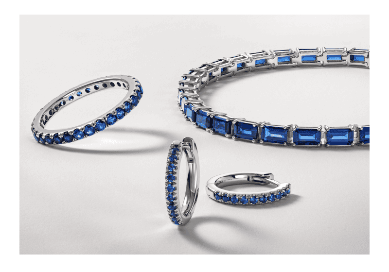 White gold sapphire ring, bracelet and hoop earrings in mixed stone cuts.