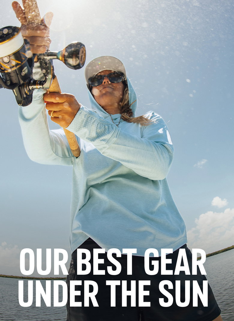 Our Best Gear Under the Sun. Woman fishing from a boat.