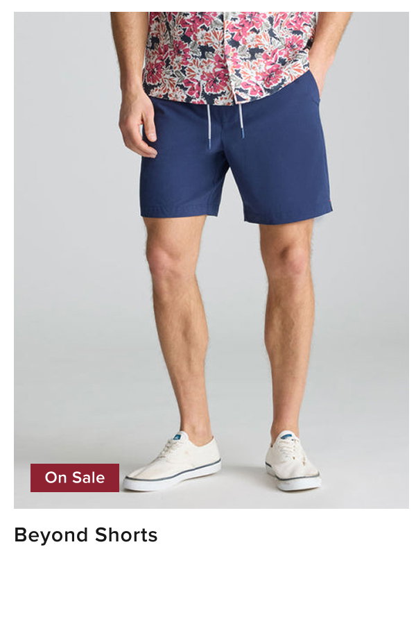 Model is wearing UNTUCKit beyond shorts in blue. 
