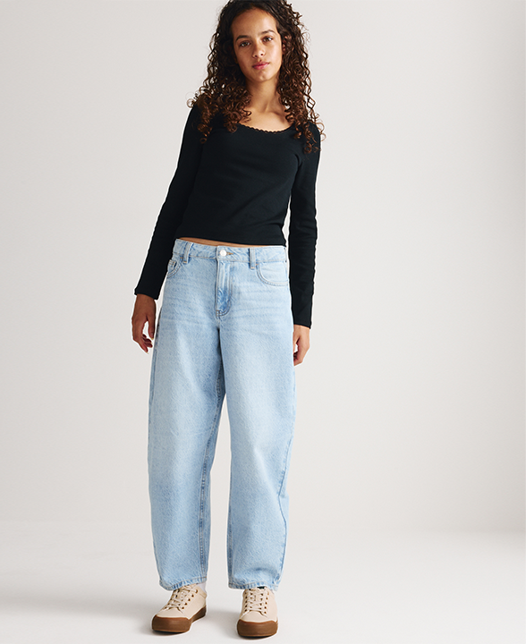 Girl wearing Denim Barrel Leg Jeans in Light Denim