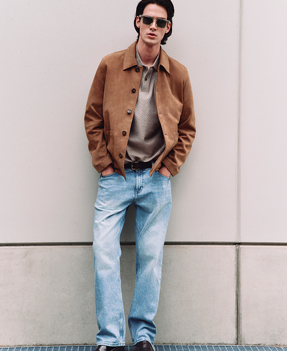 Man wearing Authentic Relaxed Straight Fit Rigid Jeans in Medium Blue with Suede Chore Jacket in Tan
