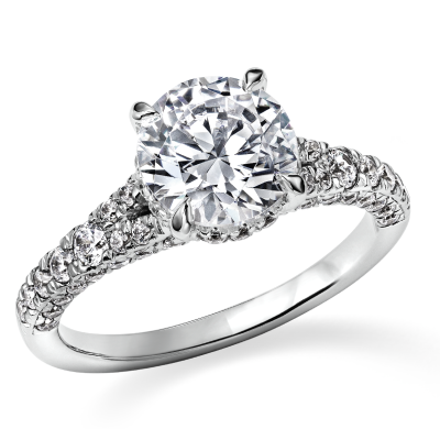 A white gold diamond ring with a round center stone and pavé-set band.